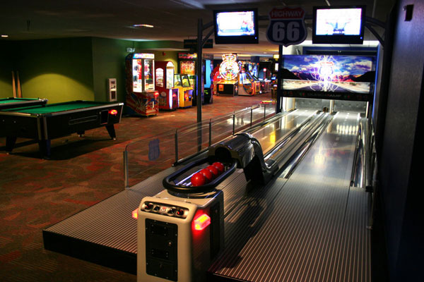 View of the electronic bowling and pool tables in the large arcade and game room at Holiday Inn Orange Lake Kissimmee