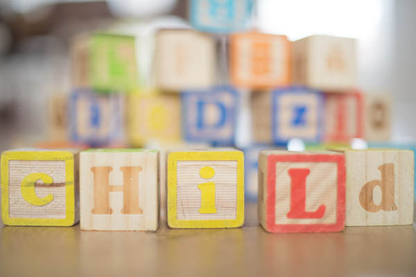 group of letter blocks spelling child 600