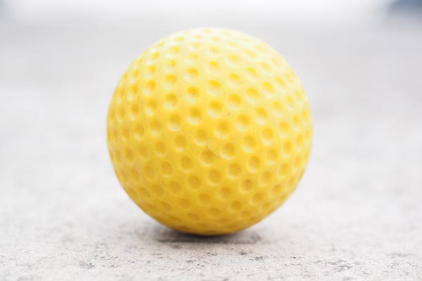 colorful yellow golfball for the miniature golf course