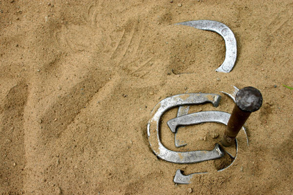 Horseshoes in a pit of sand