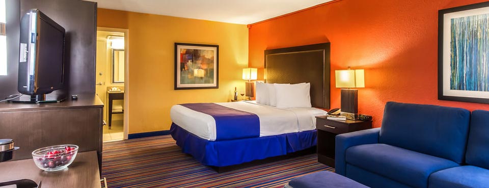 View of a Deluxe King Room with Sleeper Sofa angled from door at the Coco Key Hotel and Water Park in Orlando Fl 960