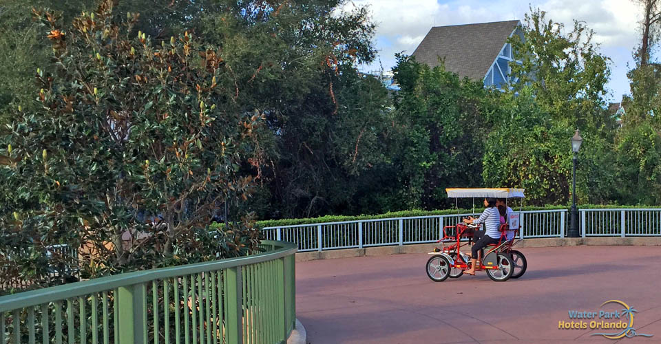 Riding a surrey bike on the path around the Disney Boardwalk Inn 960
