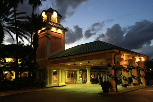 Front entrance to the Disney Caribbean Beach Resort at night during Christmas