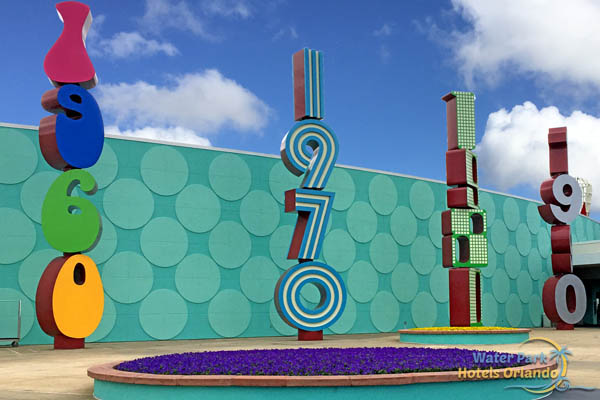 Stacked Decade Logos in front of Classic Hall at Pop Century Resort 600
