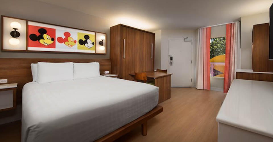 Standard Room with View of Queen Bed and Doorway at the Disney Pop Century Resort 960