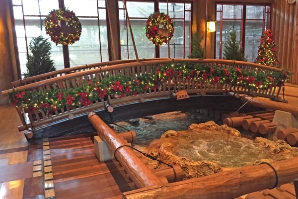 The interior bridge in the Lobby of the Disney Wilderness Lodge decorated for Christmas 600