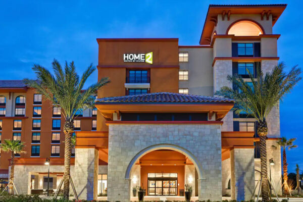 Front entrance evening to the Home2 Suites in Flamingo Crossing a Hilton Hotel 1000