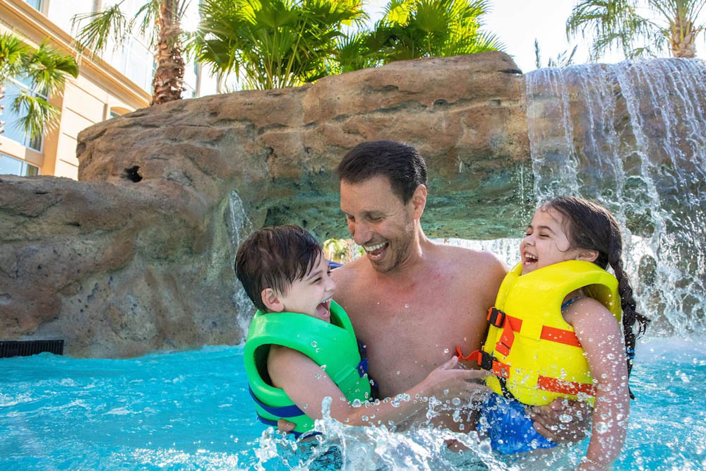 Family with Life Vests at the Crystal River Rapids lazy river at the Gaylord Palms Water Park 1000
