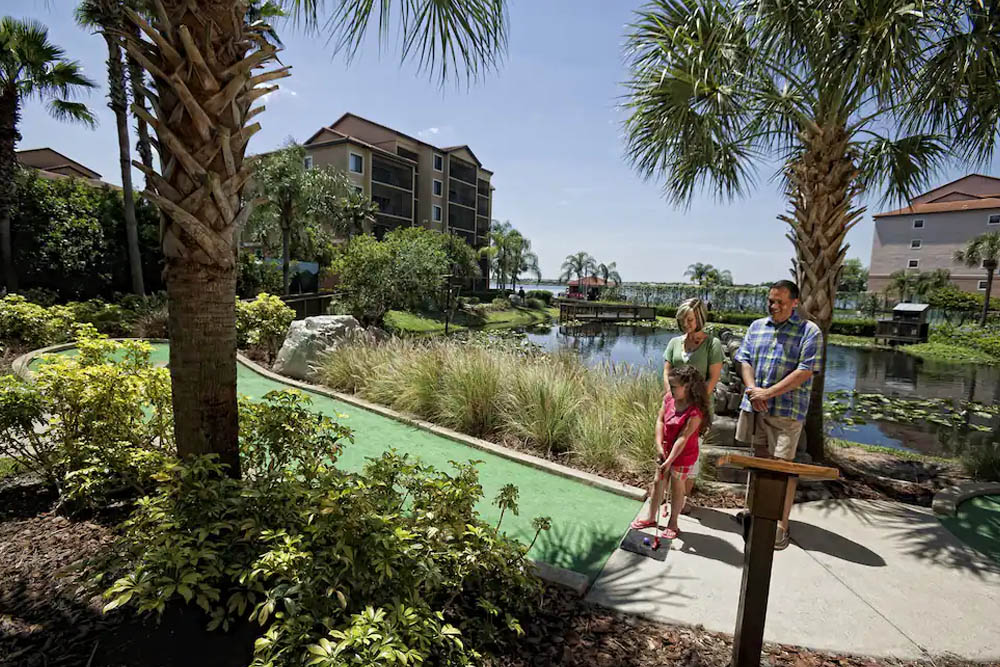 Family playing on the 18 hole Miniature Golf Course