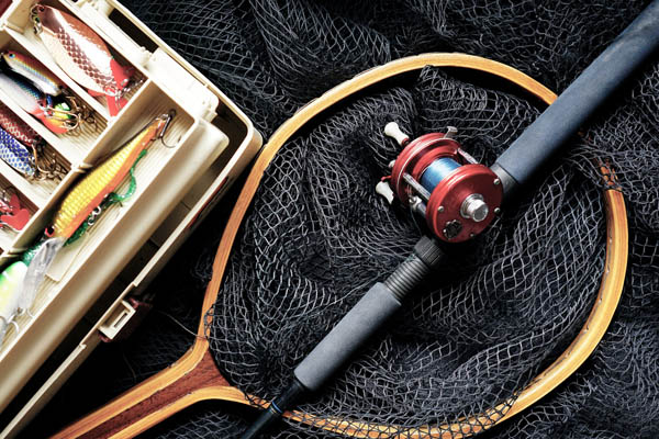 Fishing Rod on Net and Lures in a tackle box 600