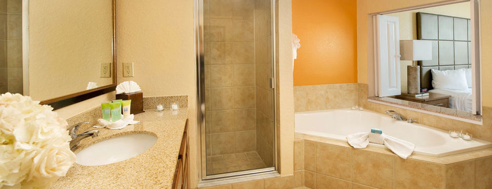 Master Bath in the 2 and 3 Bedroom Suites at the Floridays Orlando Resort with large Jacuzzi Tub and walk in shower