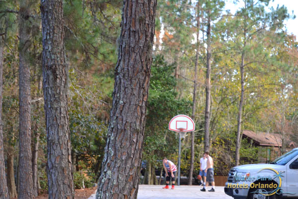 Kids playing on an outdoor basketball court at the Disney Fort Wilderness Campground