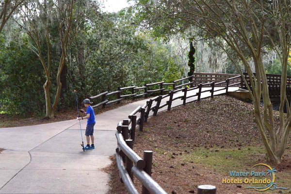 Boy with fishing pole getting ready to fish at the Disney Fort Wilderness Campground 600