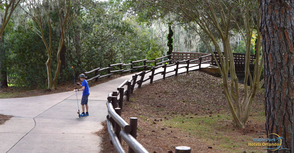 Boy with fishing pole getting ready to fish at the Disney Fort Wilderness Campground 960