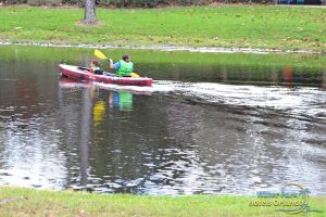 Boys in a red kayak at Disney Fort Wilderness Campground 600