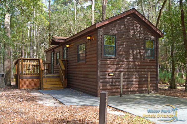 Cabin with porch and driveway at the Disney Fort Wilderness Campground 600