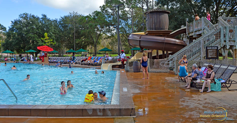 Meadows Family Pool with Water Slide in the background at the Disney Fort Wilderness Campground 600