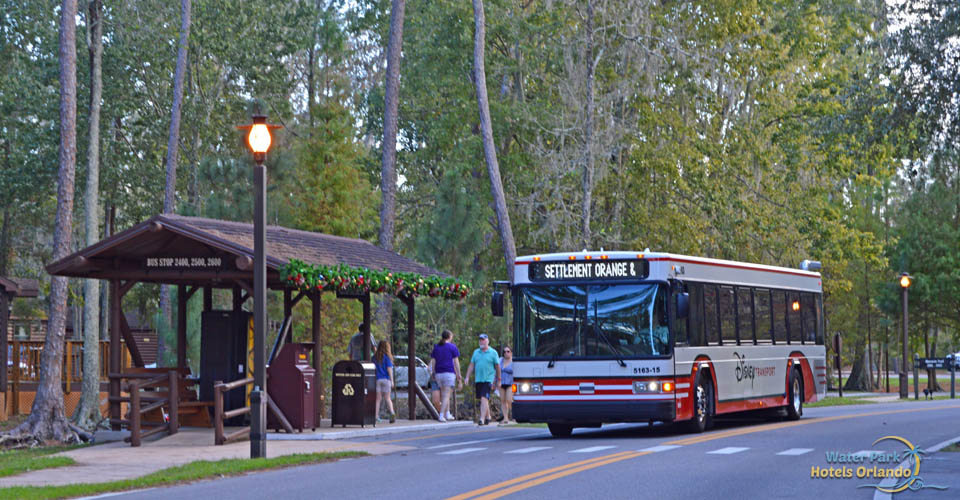 Internal orange bus line stopping for passengers at the Disney Fort Wilderness Campground
