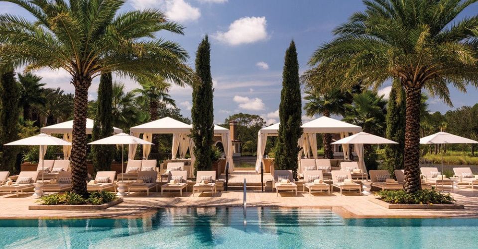Cabanas lined up across The Oasis Adults only pool at The Four Seasons Resort in Orlando 960