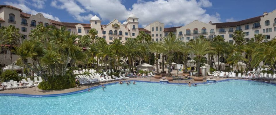 A beautiful view of the massive Hard Rock Orlando Hotel Pool with lounge chairs all around 960