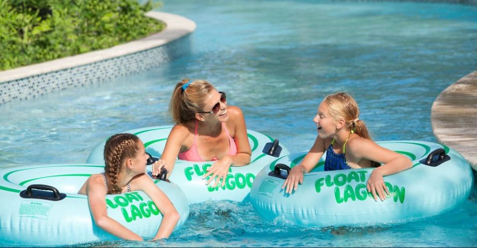 Family fun on tubes floating on the Lazy River Hilton Buena Vista Palace