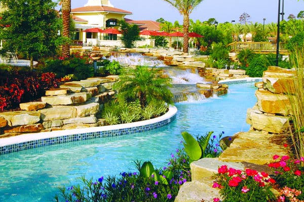 View of a section of the 1,200 foot Lazy River with Rock Water Fall at the Holiday Inn Orange Lake Resort in Orlando Fl 600