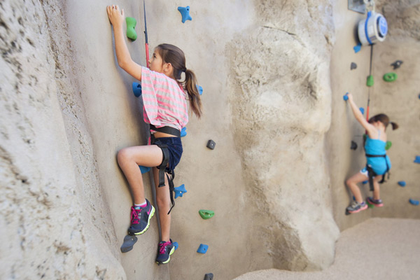 Kids on the climbing rock wall at the Hyatt Regency Grand Cypress Hotel in Orlando Fl 600