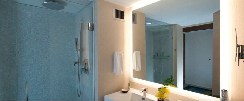 Elegant Bathrooms with solid sink tops, stand up shower unit at the Orlando Grand Cypress Hyatt Regency