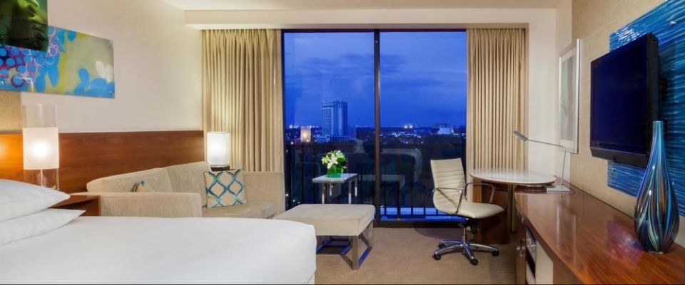 View of the Standard King Room with Sleeper Sofa and small living space at the Hyatt Regency Grand Cypress Orlando