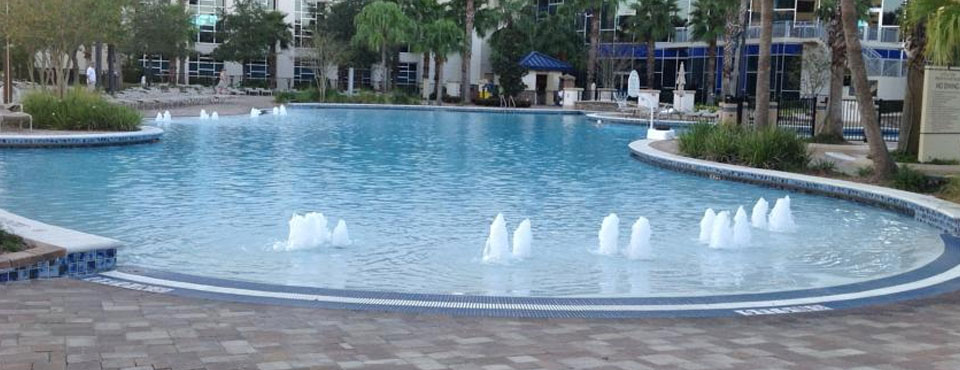 Grotto Pool with multiple gentle sloping entrances and bubbling fountains at the Hyatt Regency Orlando on International Drive in Orlando Fl