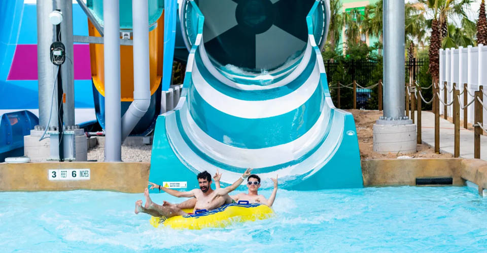 Gliding across the pool of water at the end of the Reload Rapids water slide at the Island H2O Live Water Park in Orlando 960