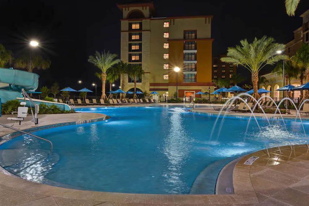 Large Outdoor Pool with steps and fountains at the Homewood Suites in Flamingo Crossing a Hilton Hotel