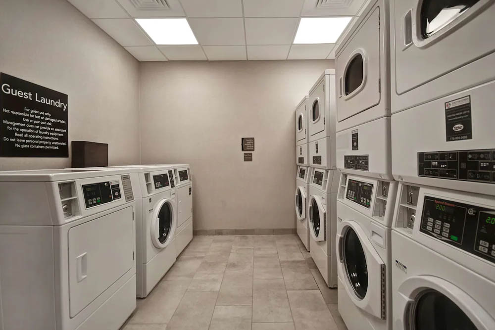 Laundry Room with multiple washers and dryers