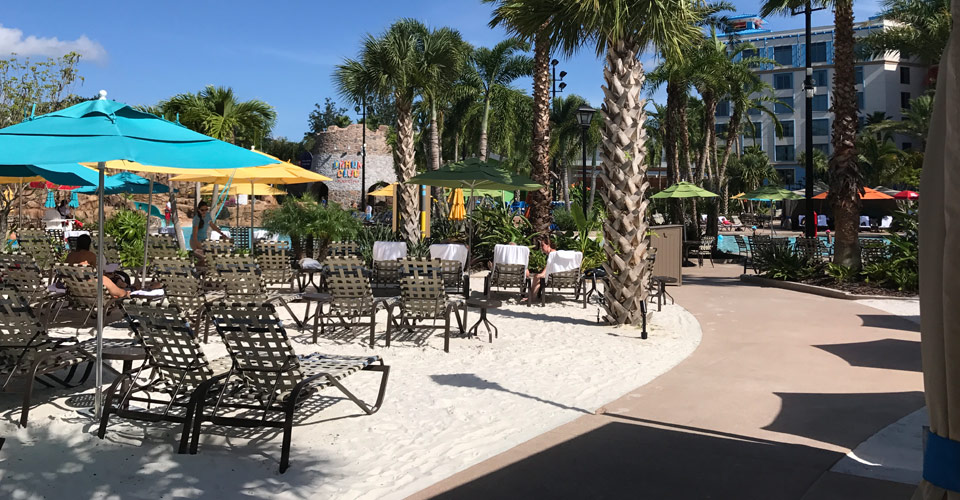 View of the White Sand under Beach Chairs at the Loews Sapphire Falls Resort Huge Outdoor Pool in Orlando