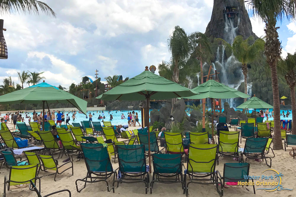 Lounge and Beach Chairs in the sand at the Waturi Beach Wave Pool at Universal's Volcano Bay Water Park 1000