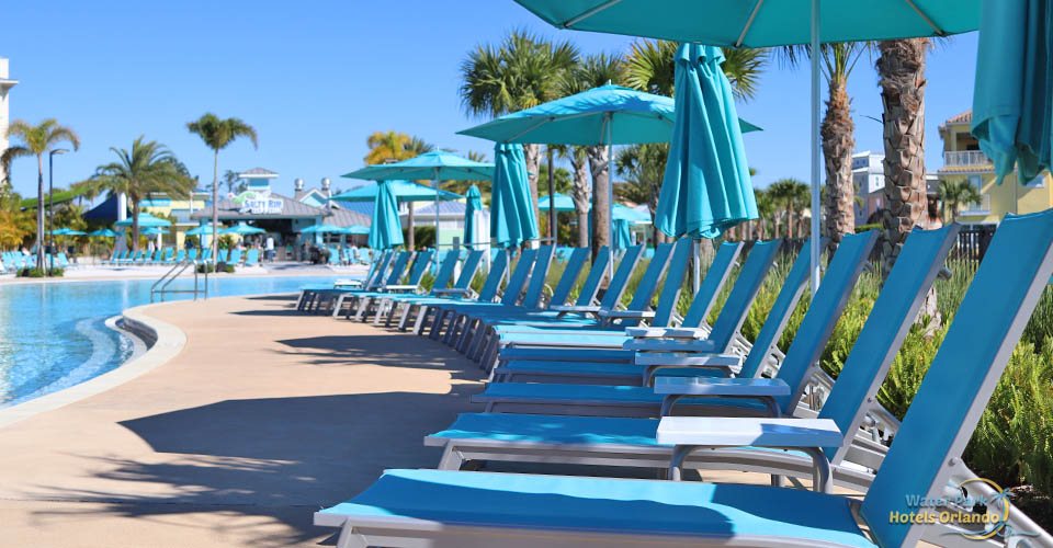 View of the Chaise Lounge Chairs and umbrellas at the Fins Up Beach Club pool at the Margaritavilla Resort in Orlando 960