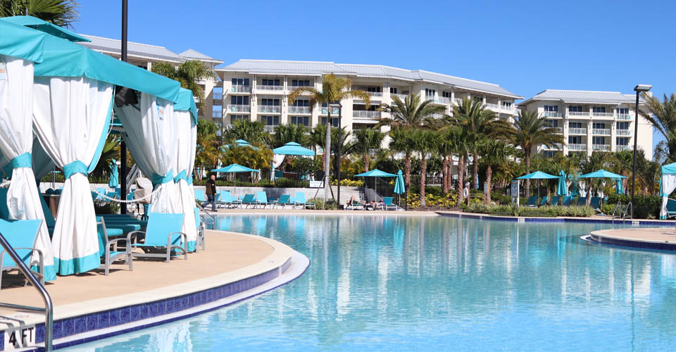 Fins Up Beach Club pool overlooking water at the Margaritavilla Resort in Orlando with Cabanas 960