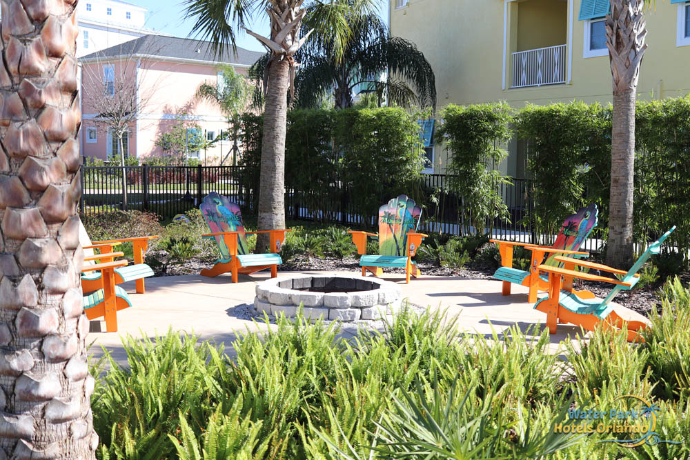 Firepit surrounded by colorful Adirondack chairs at the Margaritavilla Resort in Orlando 1000