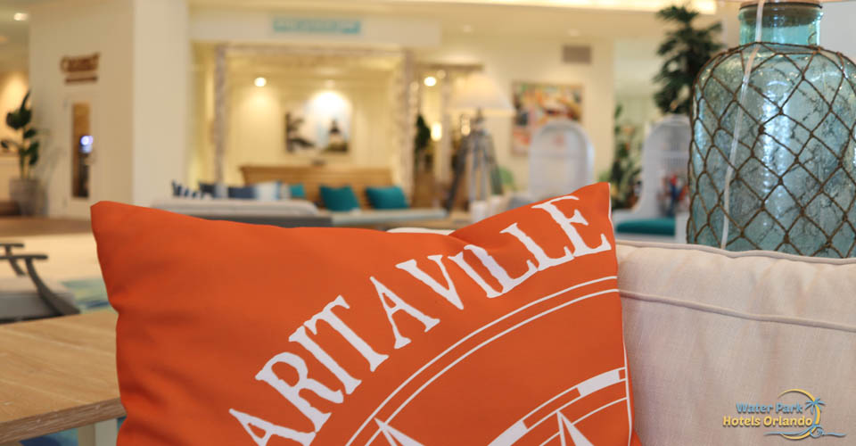 Orange Margaritaville Pillow on a comfy sofa in the lobby at the Margaritavilla Resort in Orlando 960