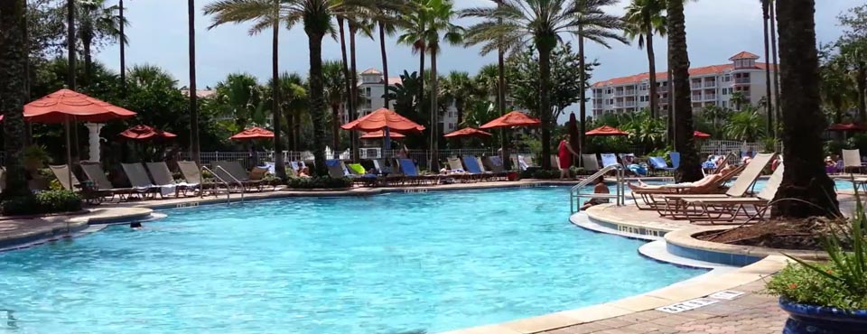 View of an Outdoor Heated Pool with Seating and Umbrellas at the Grande Vista Marriott Resort in Orlando Fl