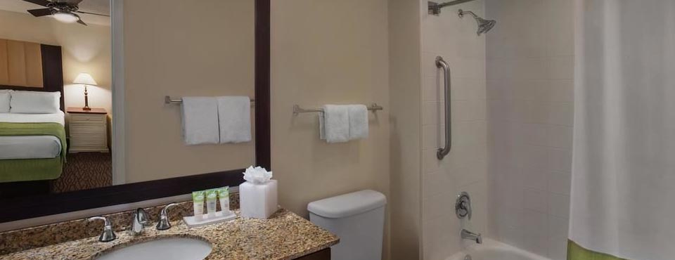 The Bathroom is spacious with a granite counter sink and tub shower unit at the Marriott Harbour Lake in Orlando