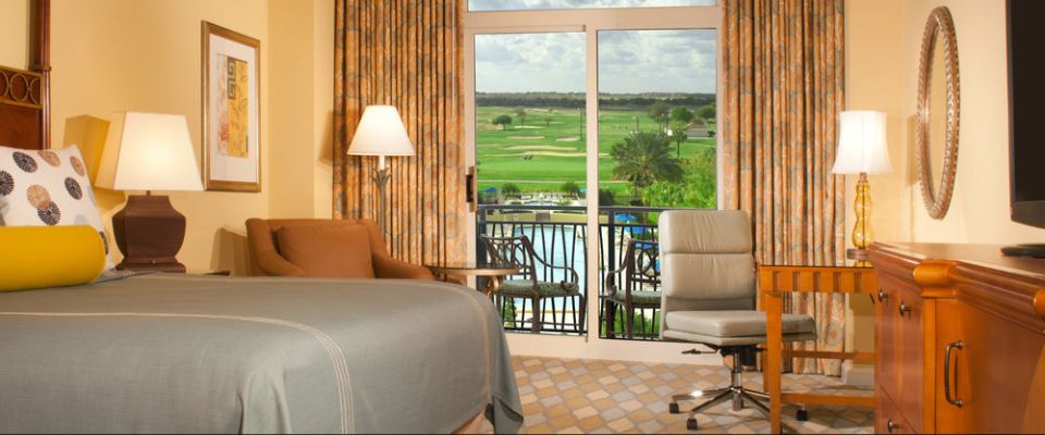 View of a Premier King Room with balcony and amazing views of the Golf Course at the Omni Orlando ChampionsGate Resort