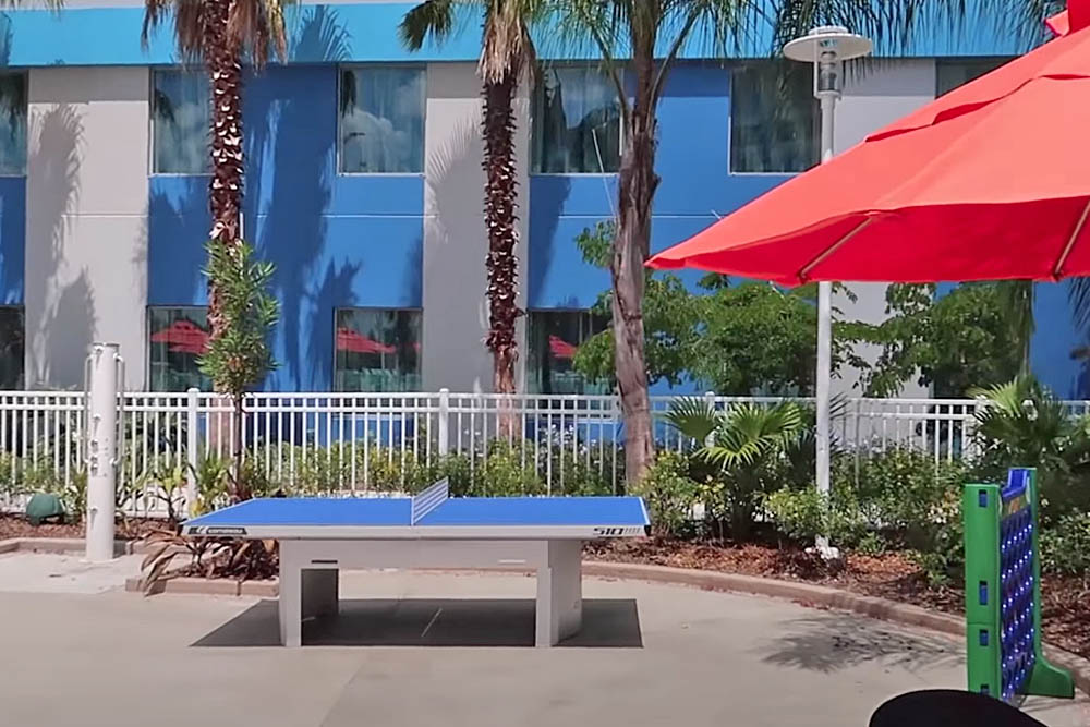 Outdoor Games and Ping Pong table at the Surfboard Pool at the Universal Endless Summer Resort Surfside Inn and Suites 1000
