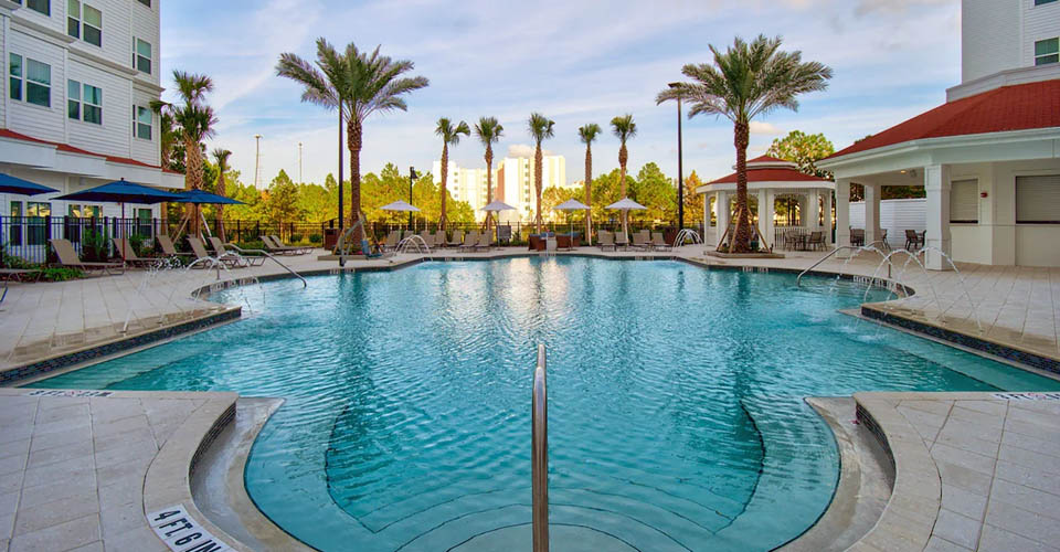 Pool view with fountains and sun deck at the Residence Inn at Flamingo Crossing in Orlando Florida 960