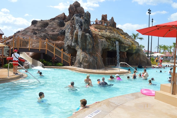 Large Swimming Pool wiht Volcano Water Slide at the Disney Polynesian Village Resort Orlando wide