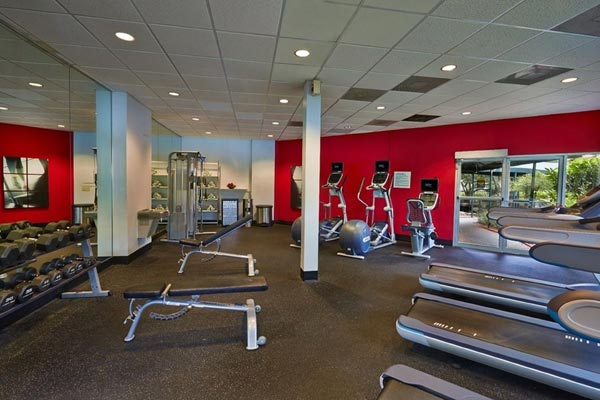 View of the Treadmills, Eliptical, Free Weights and Towel Center at the Fitness Center in the Radisson Resort in Orlando Celebration 600