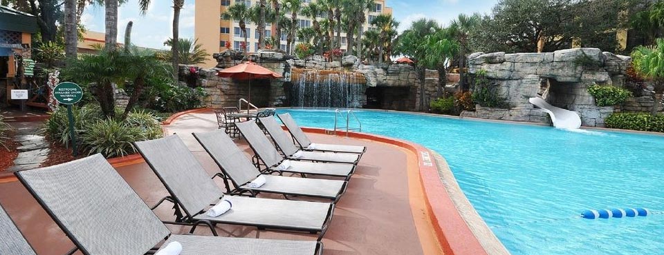 View of the Outdoor Heated Pool with Seating, Waterfall in the Background and the Water Slide at the Radisson Resort in Orlando Fl Celebration 960