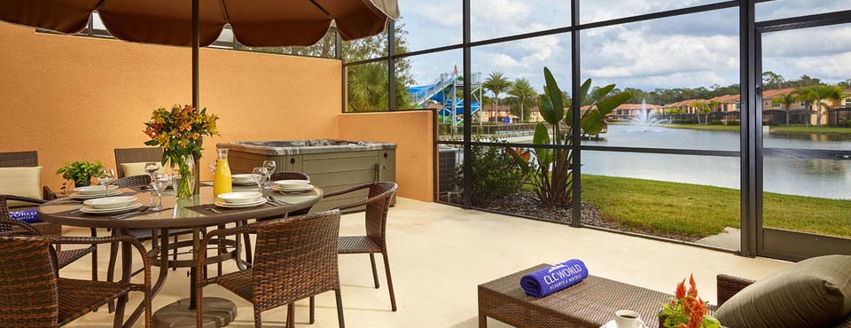 The Patio with outdoor dining, seating and large hot tub in a 3 bedroom townhouse at the Regal Oaks Resort CLC in Kissimmee Fl