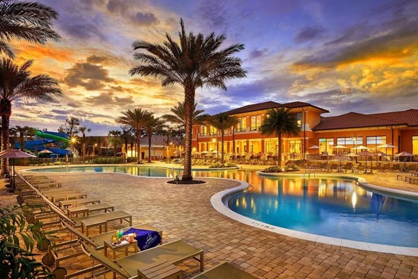 View of a beautiful evening by the pool at the Regal Oaks Resort CLC in Kissimmee Fl 600