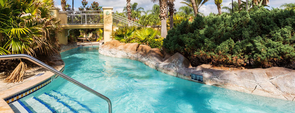 Lazy River going under the bridge leading to the island in the center of the water park at the Regal Palms Resort